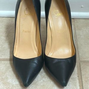 Louboutin So Kate red bottoms.